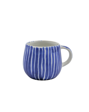 Blue and white striped stoneware mug on a white background Blue and white striped stoneware mug on a white background