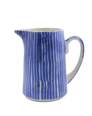 Blue and white striped ceramic pitcher on a white background Blue and white striped ceramic pitcher on a white background