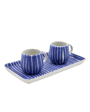 Two blue and white striped ceramic cups with matching saucer on a white background Two blue and white striped ceramic cups with matching saucer on a white background