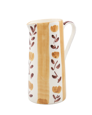 Ceramic pitcher with floral design on a white background Ceramic pitcher with floral design on a white background