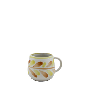 Ceramic mug with leaf pattern on a white background Ceramic mug with leaf pattern on a white background