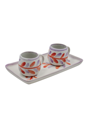 Ceramic set with two cups and a tray featuring floral designs on a white background Ceramic set with two cups and a tray featuring floral designs on a white background