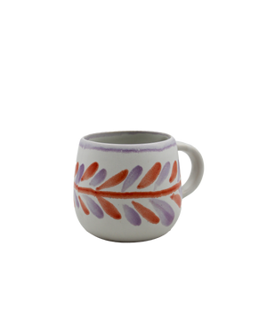Ceramic mug with colorful leaf pattern on a white background Ceramic mug with colorful leaf pattern on a white background