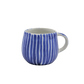 Blue and white striped stoneware mug on a white background
