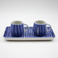 Two blue and white striped ceramic cups with a matching tray on a light gray background