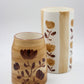 Two ceramic vases with floral patterns on a white background