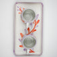 Two ceramic cups with a floral design on a white background