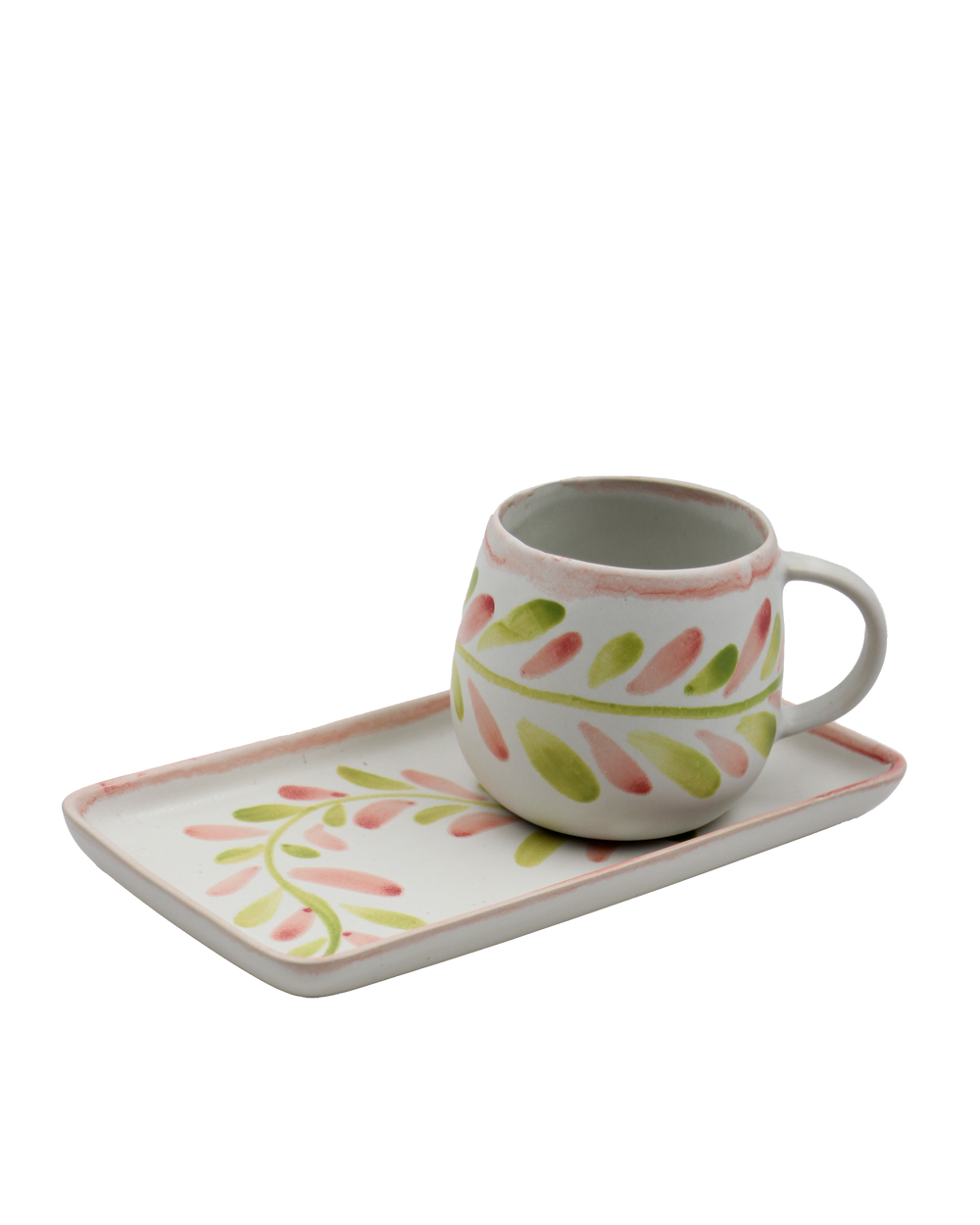 Ceramic mug and tray set with floral patterns on a white background