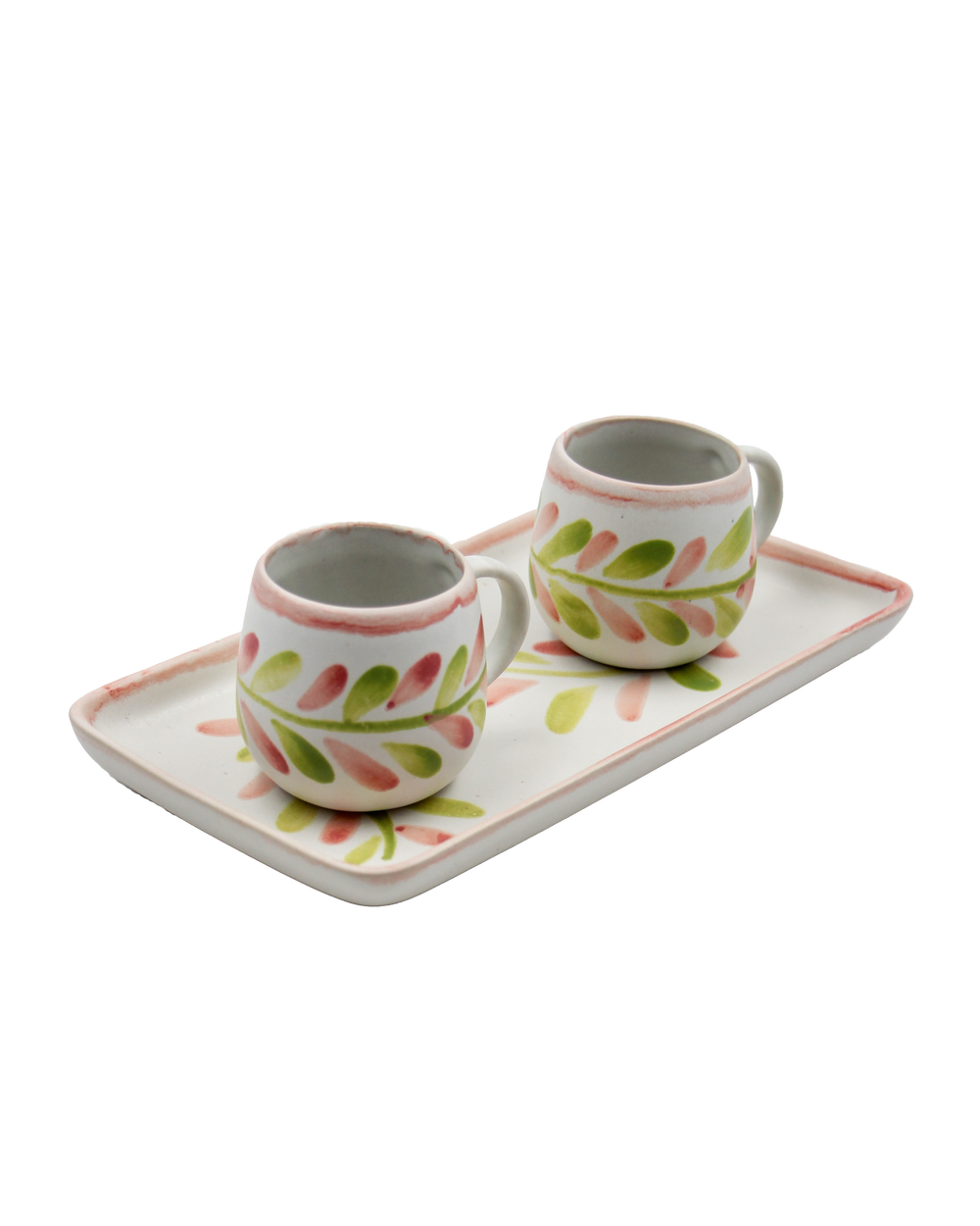 Two ceramic mugs with floral designs on a matching tray against a white background