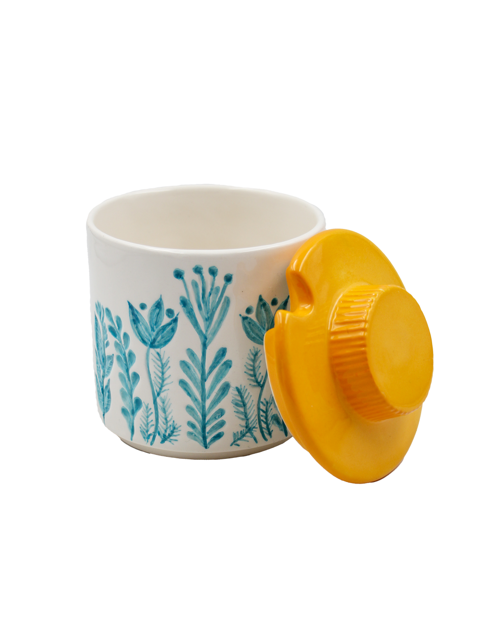 White container with blue floral pattern and yellow lid on a white background